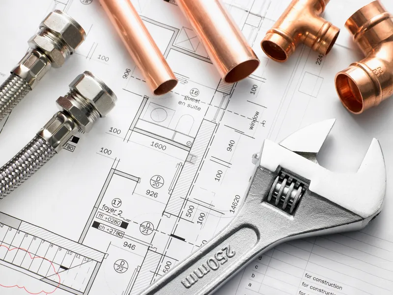 Plumber explaining process to customer