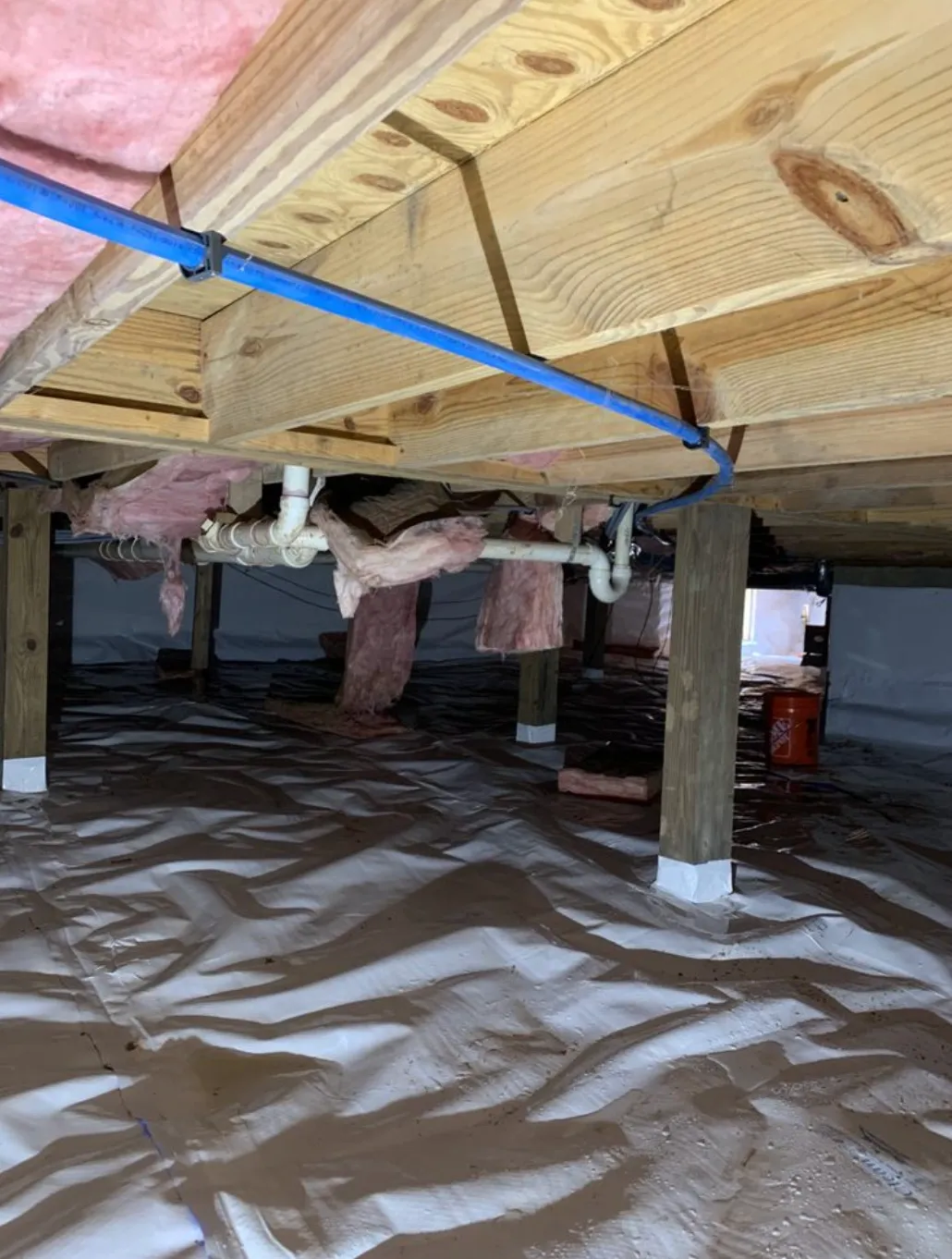 Plumber repairing water supply pipes in a Roswell, GA home