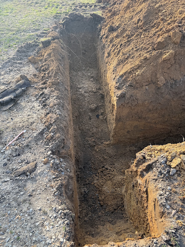 Plumber working on a sewage line to stop a sewer backup in Atlanta