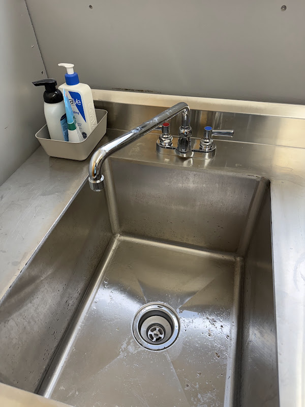 Commercial stainless steel sink and faucet installed by an Atlanta commercial plumber